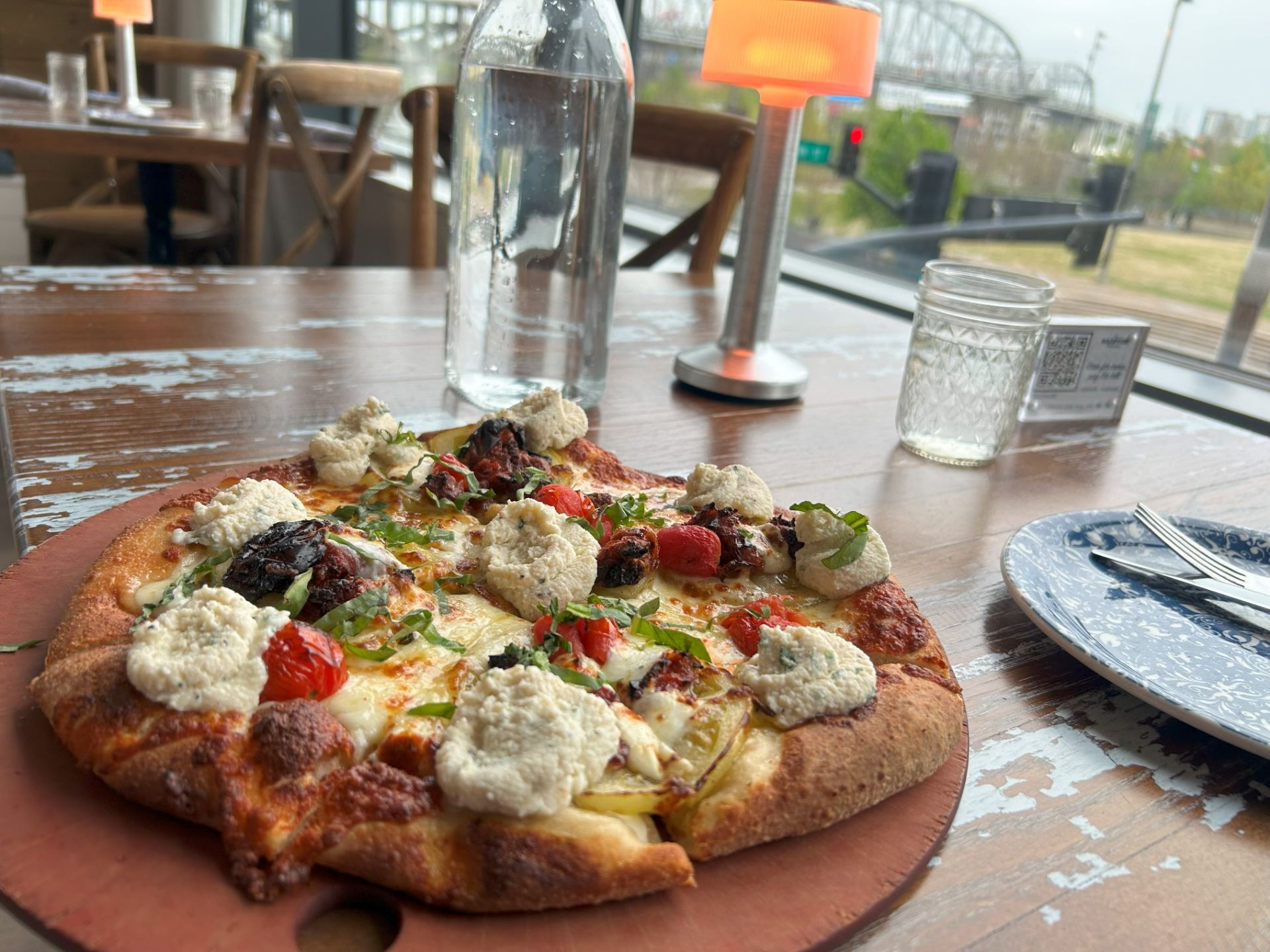Wood-fired vegetable pizza with herbs and ricotta