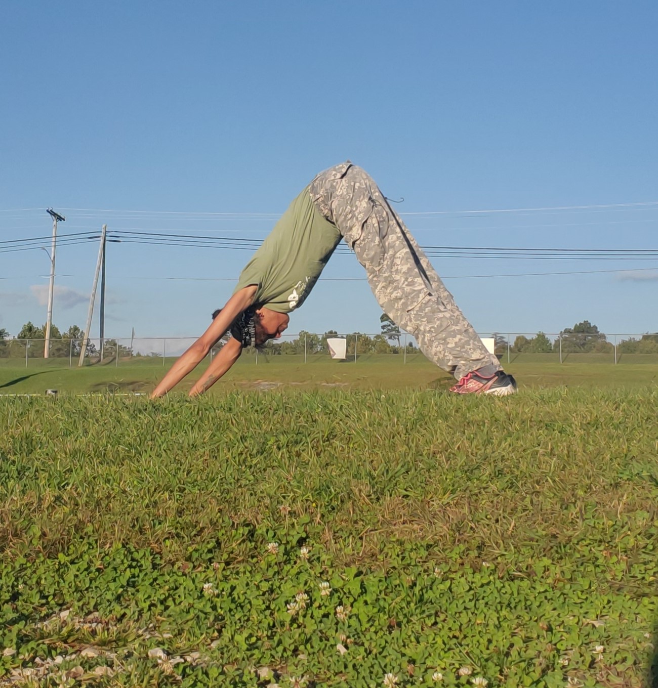 Yoga downward dog pose outdoors